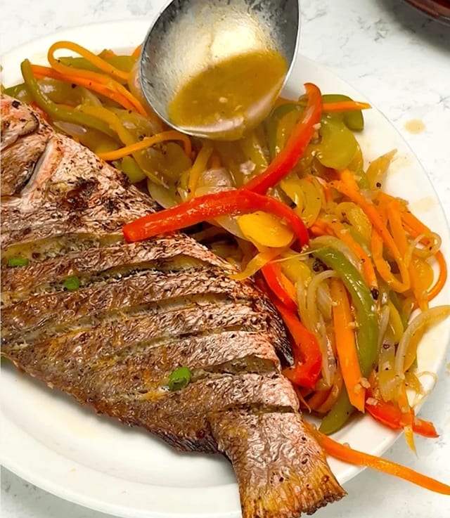 Snapper option 4 escovitch with carrots, bell peppers, onion, garlic in vinegar (done to order).
